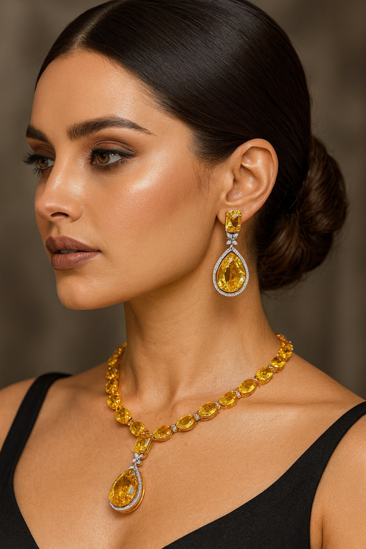 
3. Yellow Citrine Necklace Set

A radiant yellow citrine necklace set with teardrop and emerald-cut stones, bordered by shimmering accents. The vibrant golden hues add a bold yet classy touch, making it the perfect statement piece for festive and party wear.